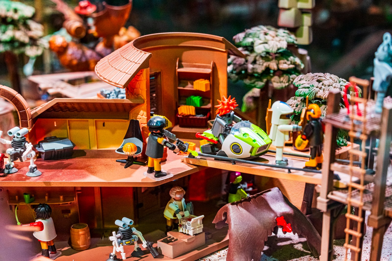 Sci-fi outpost with robots and a moon rover